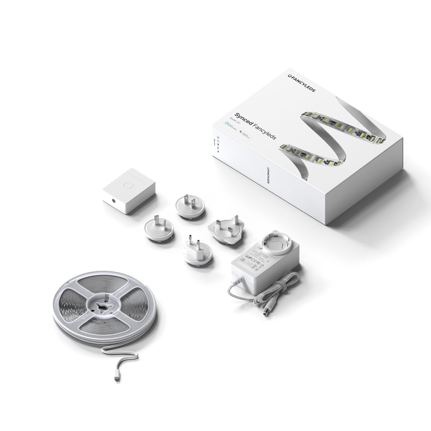 Everything included in the Synced Fancyleds kit: control box, RGBW LED strip and universal power adaptor